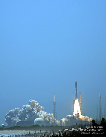 Rocket launch photography tips; picture of an Atlas V rocket, NASA Juno mission, photographed from Playalinda Beach, Canaveral National Seashore. Rocket Launch Tips Article.© 2011, Stephen Kristof for FreePhotoCourse.com; all rights reserved.  