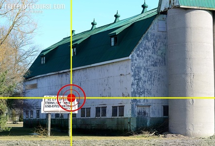 Picture of a farm barn with a traditional religious Christian sign in the foreground.  Part of a photo composition tutorial by FreePhotoCourse.com; © 2012, all rights reserved.