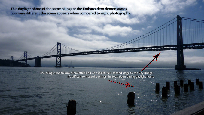 Picture of pilings and the Bay Bridge in the San Francisco Bay at foot of the Embarcadero waterfront.  FreePhotoCourse.com's San Francisco EXPOSED photography exhibit.