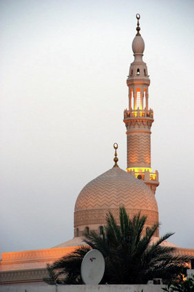 Picture of a mosque and satellite dish together.  Photo credit: Ian Ganderton, UK.  Visit FreePhotoCourse.com for free photography tips, tutorials and lessons.
