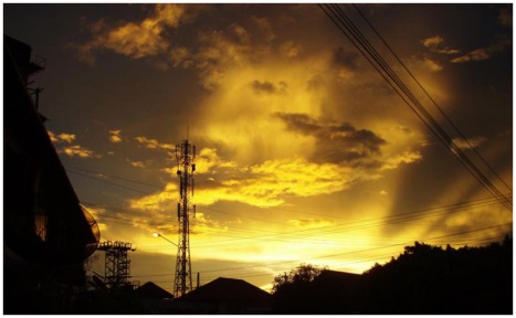 Picture of Sunset over Laos.  This shows an interesting mix of nature and human development.  Visit www.FreePhotoCourse.com for more beautiful pictures in our Contributor's Gallery.