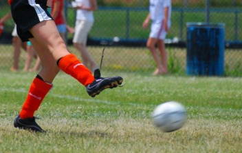 soccer kick at 1/250 of a second shutter speed -© 2010, FreePhotoCourse.com, all rights reserved 